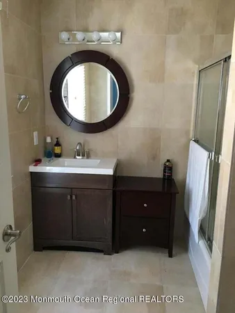 a bathroom with a sink a vanity and a mirror