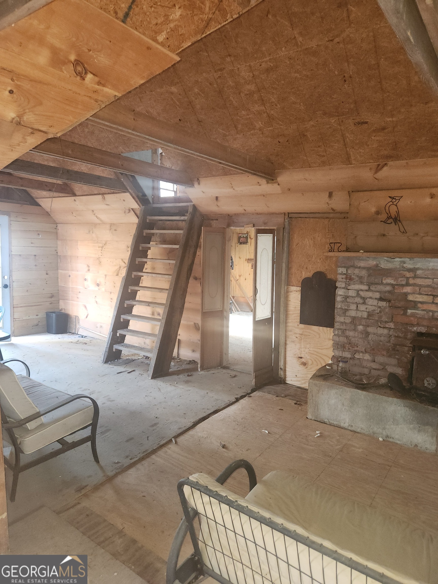 2911 Paradise Valley Road Cleveland, GA 30528 - Photo 2 of 8 a living room with couches and a fireplace