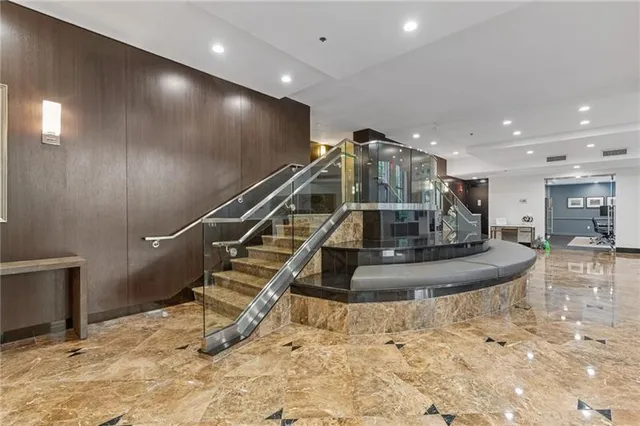 a large room with a large window and wooden floor