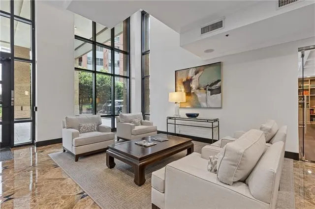 a living room with furniture and a large window