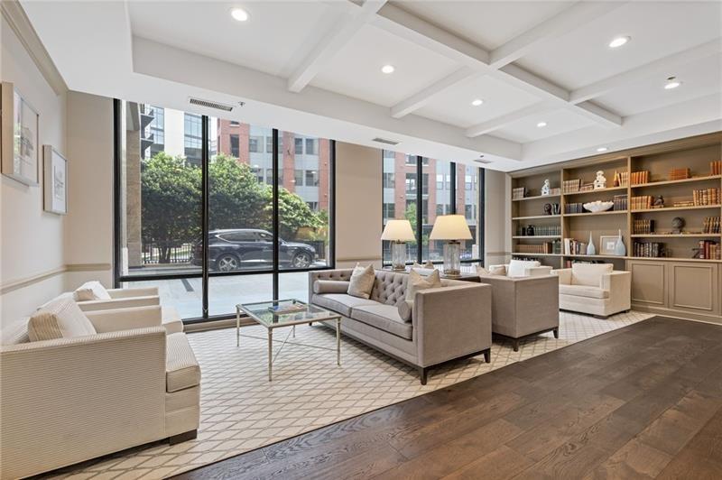 3481 Lakeside Drive Northeast, Unit 901 Atlanta, GA 30326 - Photo 22 of 38 a living room with furniture and a large window