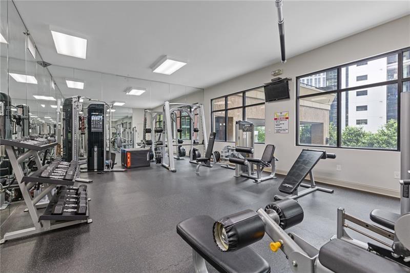 3481 Lakeside Drive Northeast, Unit 901 Atlanta, GA 30326 - Photo 29 of 38 a room with gym equipment and a large window