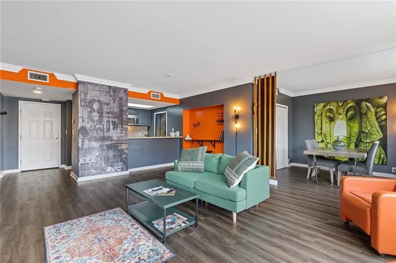 3481 Lakeside Drive Northeast, Unit 901 Atlanta, GA 30326 - Photo 4 of 38 a living room with furniture and a large window