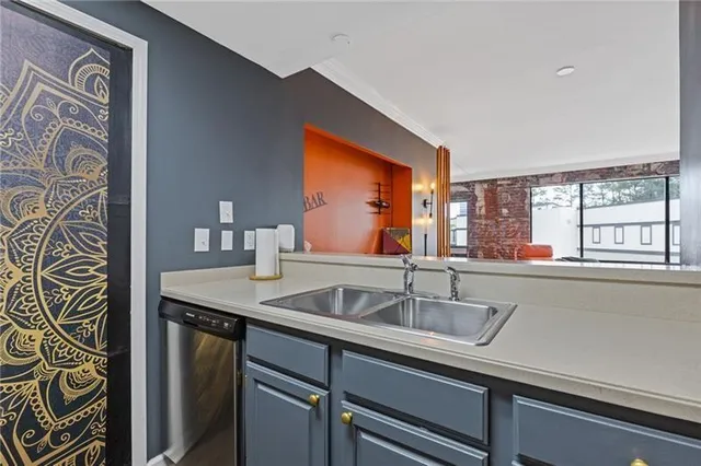 a kitchen with a sink and a window
