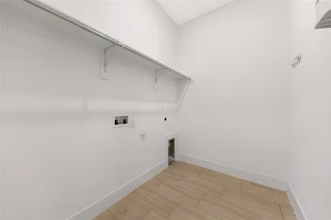 a bathroom with a sink a toilet and shower curtain