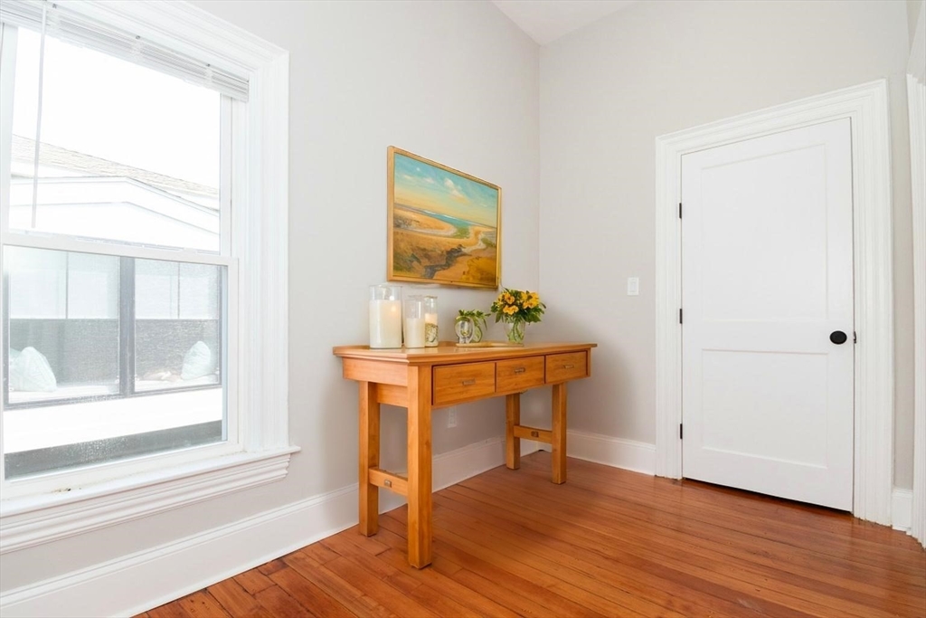 14 Grant Street Boston, MA 02125 - Photo 7 of 17 a workspace room with wooden floor and windows