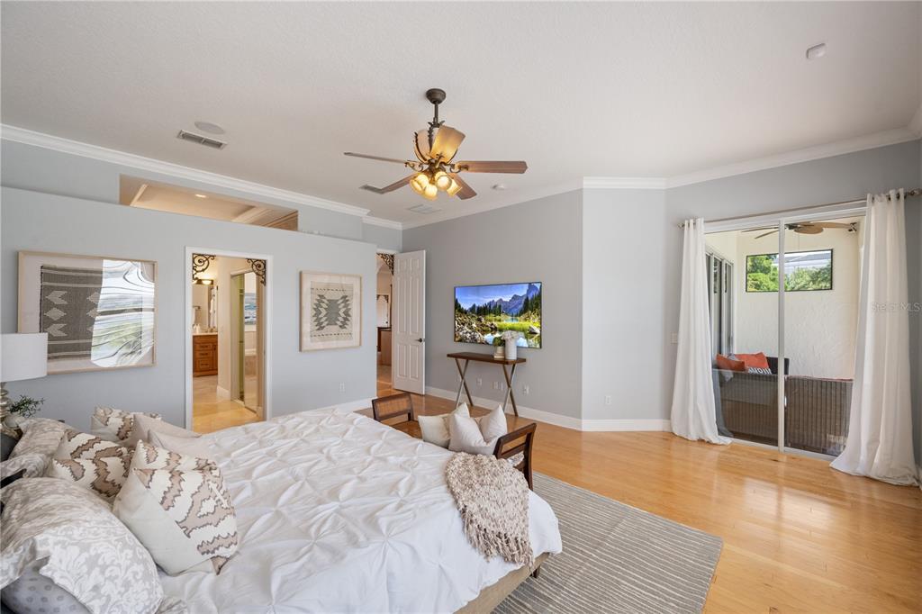 8119 Vía Rosa Orlando, FL 32836 - Photo 19 of 62 a bedroom with a bed and wooden floor
