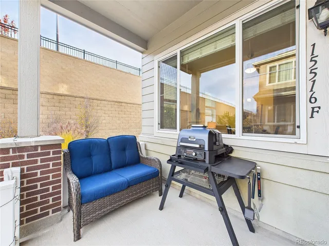 a blue chair sitting in front of a window