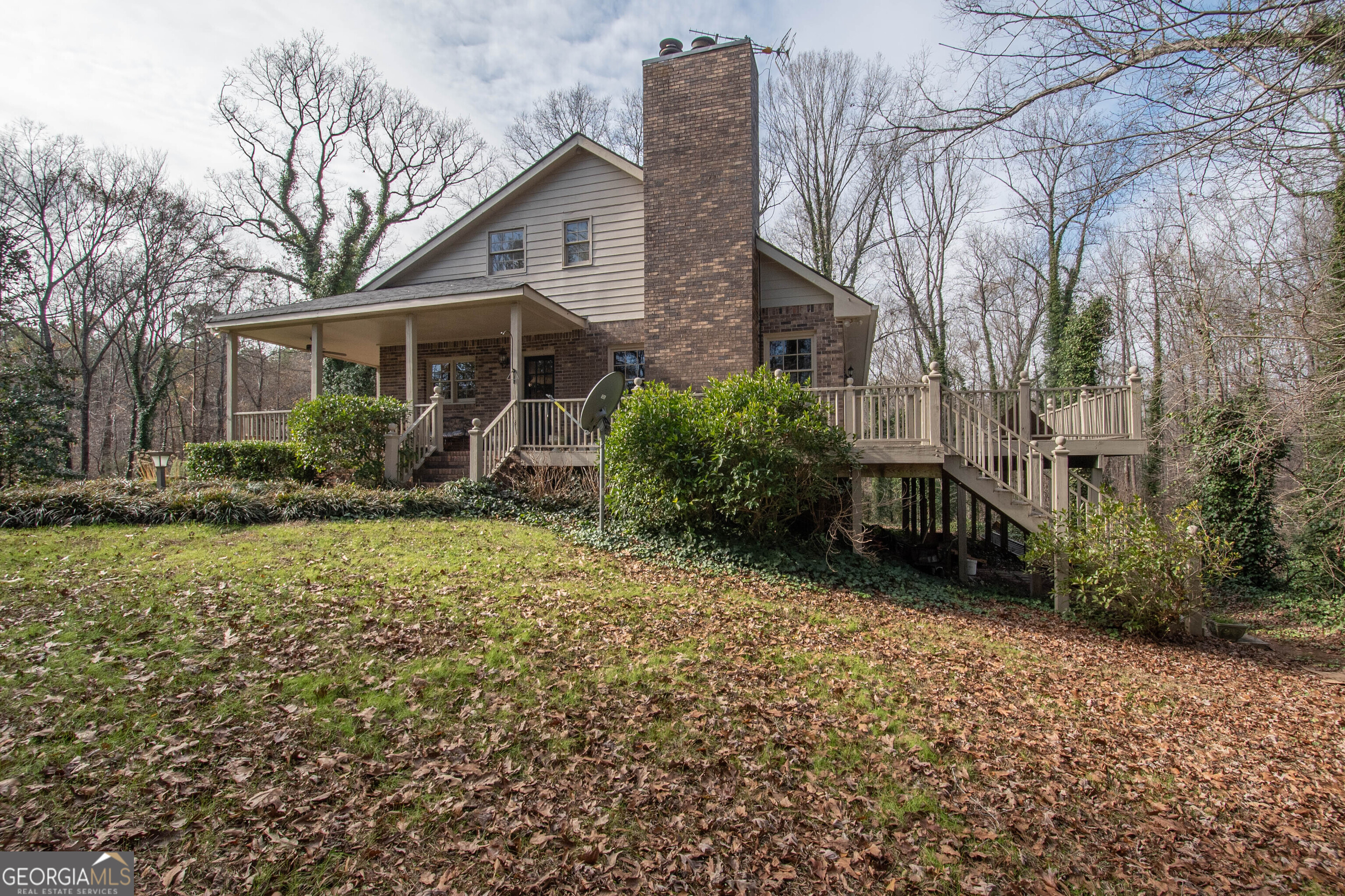 151 Evans Road Milner, GA 30257 - Photo 28 of 53 a view of a house with backyard and garden
