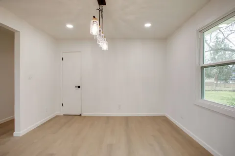 an empty room with a empty space and a window