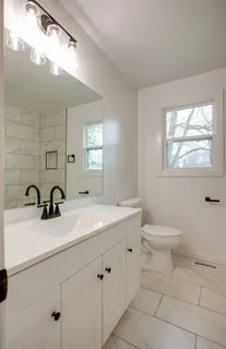 a bathroom with a sink and a toilet