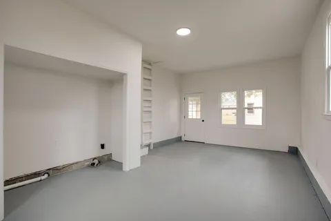 an empty room with windows