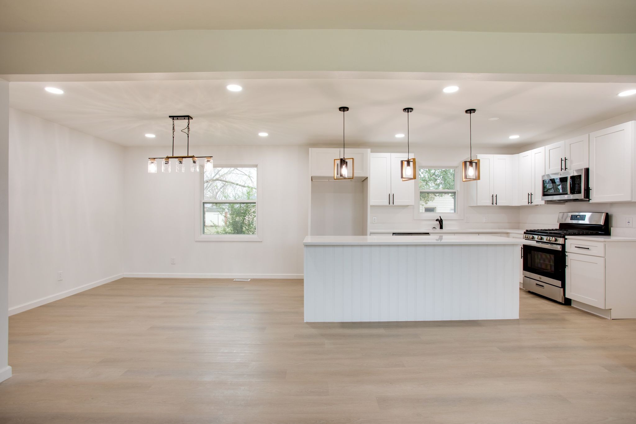 223 Hampton Road Columbia, TN 38401 - Photo 10 of 38 a large kitchen with kitchen island a white counter space a stove a sink and a refrigerator
