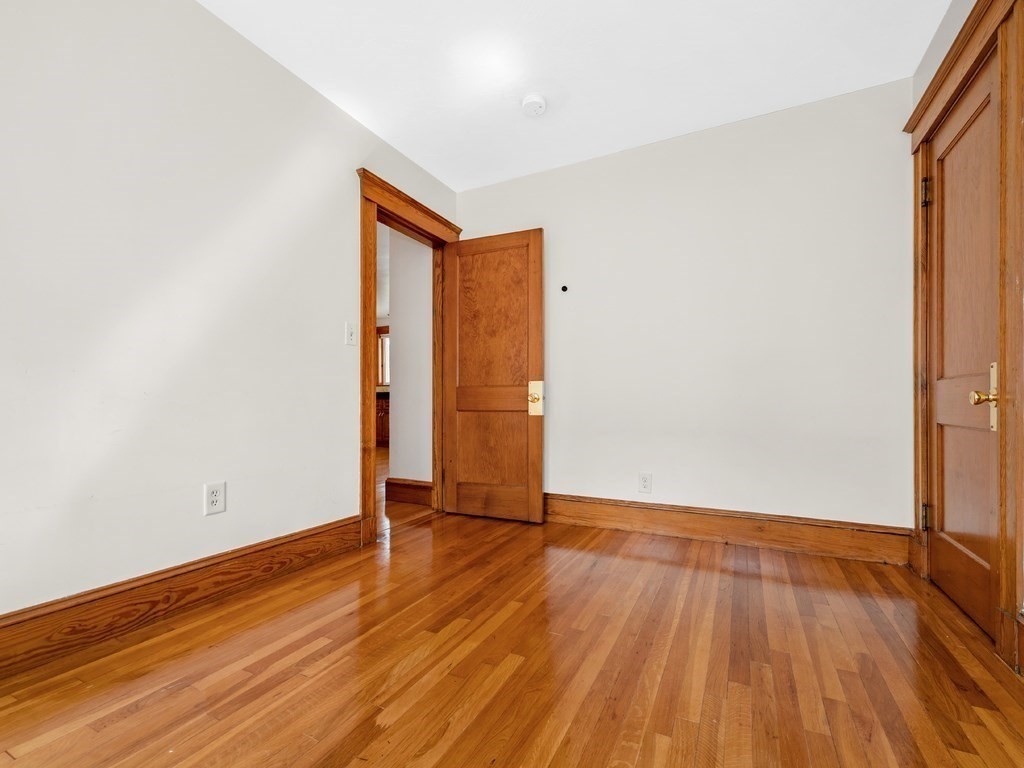 194 School Street, Unit 194 Watertown, MA 02472 - Photo 14 of 24 a view of an empty room with wooden floor