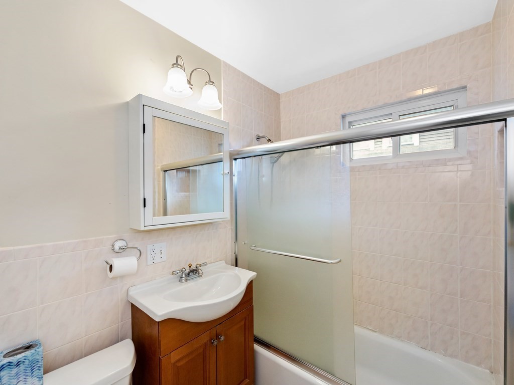 194 School Street, Unit 194 Watertown, MA 02472 - Photo 17 of 24 a bathroom with a sink and a mirror
