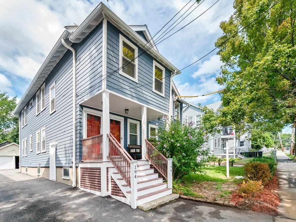 194 School Street, Unit 194 Watertown, MA 02472 - Photo 2 of 24 a front view of a house with a yard
