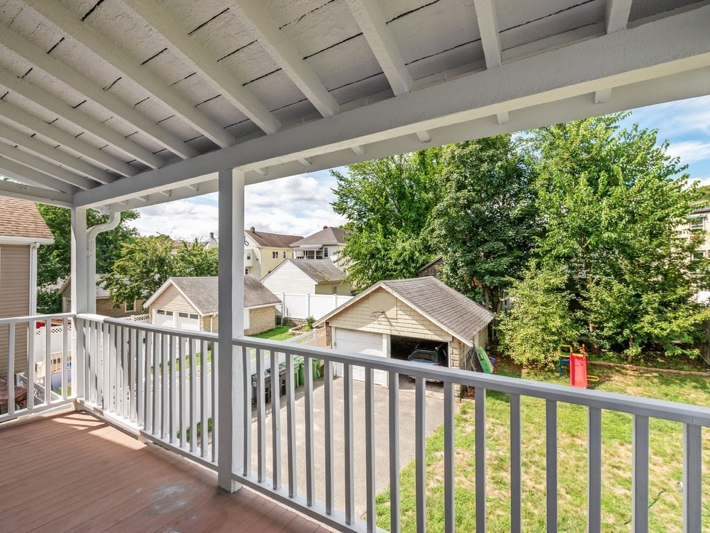 194 School Street, Unit 194 Watertown, MA 02472 - Photo 23 of 24 a view of a wooden deck next to a yard