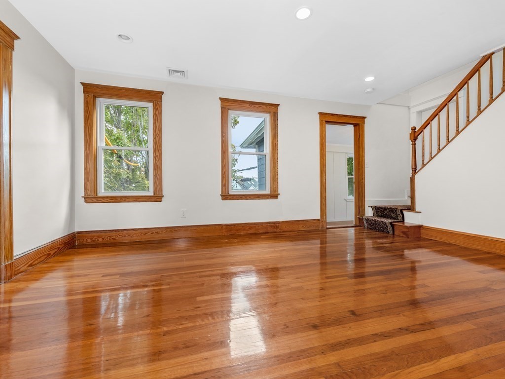 194 School Street, Unit 194 Watertown, MA 02472 - Photo 3 of 24 a view of an empty room with window and wooden floor