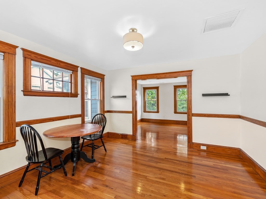 194 School Street, Unit 194 Watertown, MA 02472 - Photo 7 of 24 a view of a dining room with furniture window and wooden floor