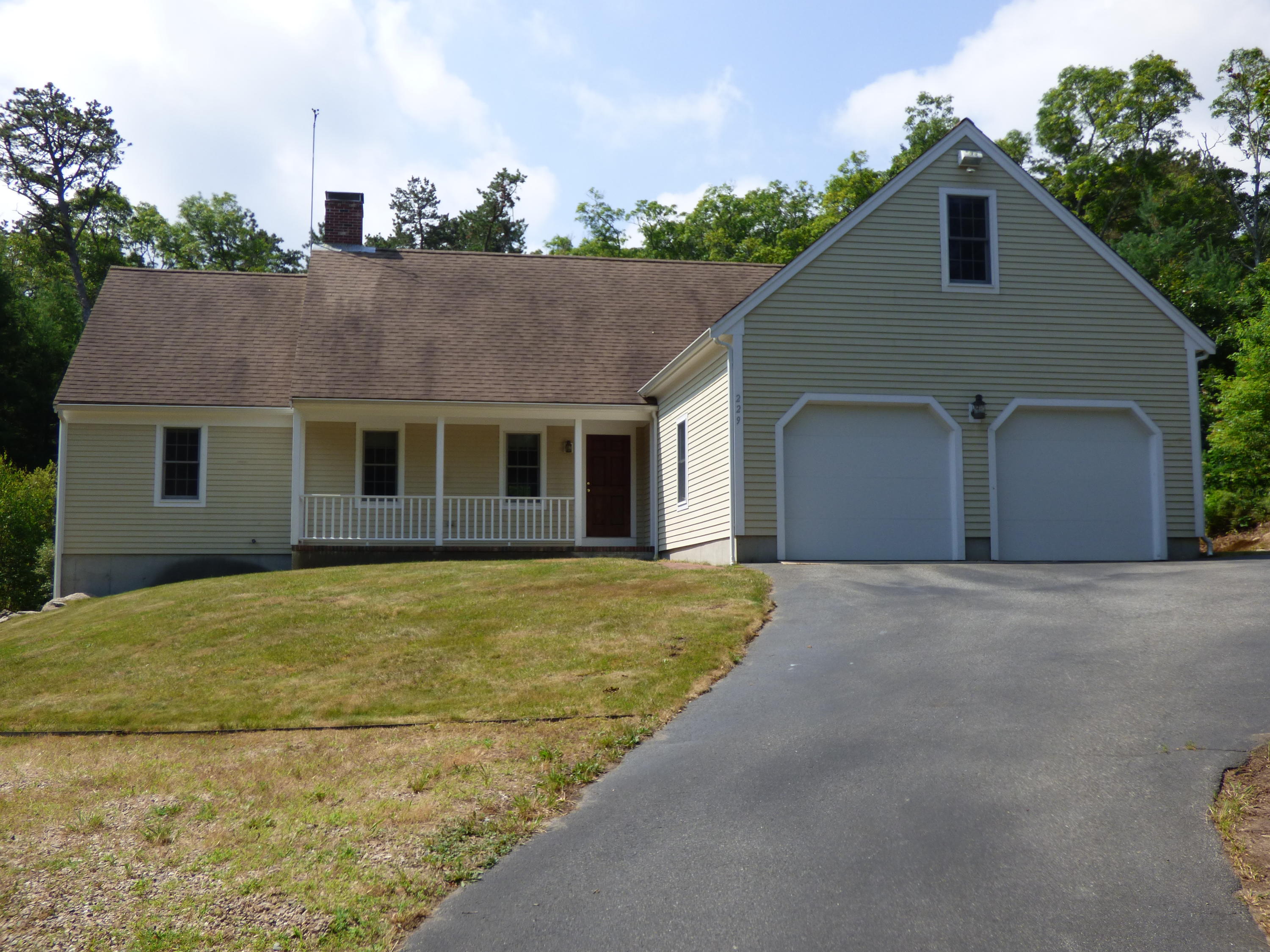 229 Woodside Road West Barnstable, MA 02668 - Photo 1 of 26 a front view of a house with a garden