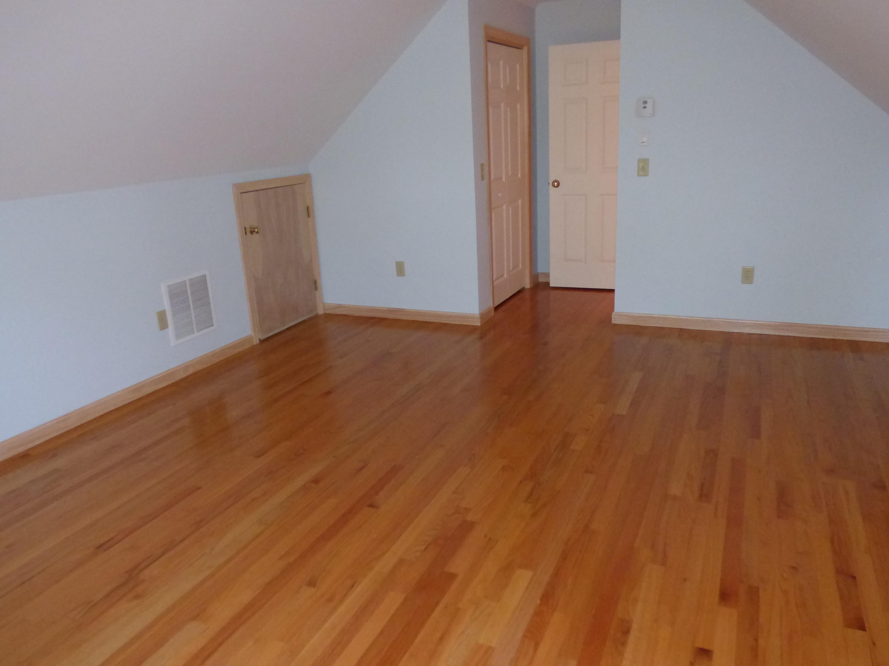 229 Woodside Road West Barnstable, MA 02668 - Photo 14 of 26 a view of an empty room with wooden floor