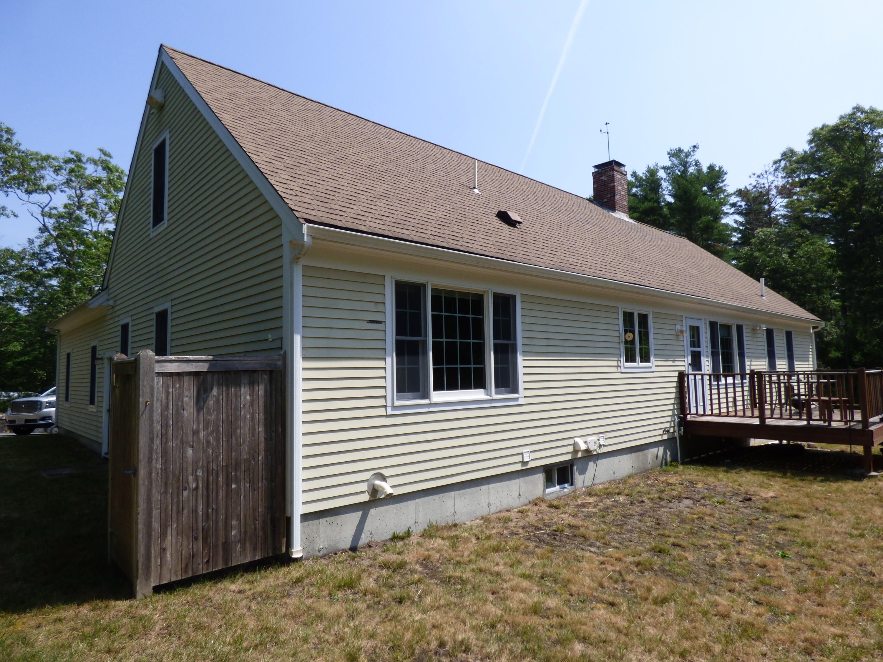 229 Woodside Road West Barnstable, MA 02668 - Photo 18 of 26 a front view of a house with a yard