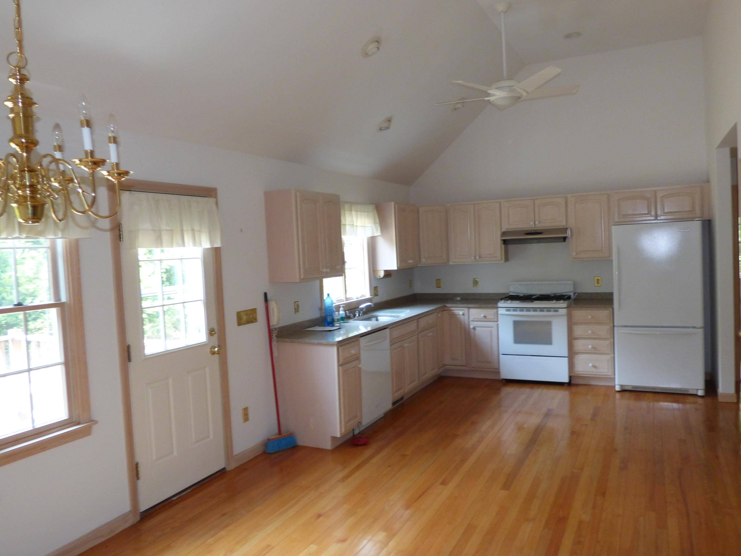 229 Woodside Road West Barnstable, MA 02668 - Photo 4 of 26 a kitchen with granite countertop a window a sink and stainless steel appliances