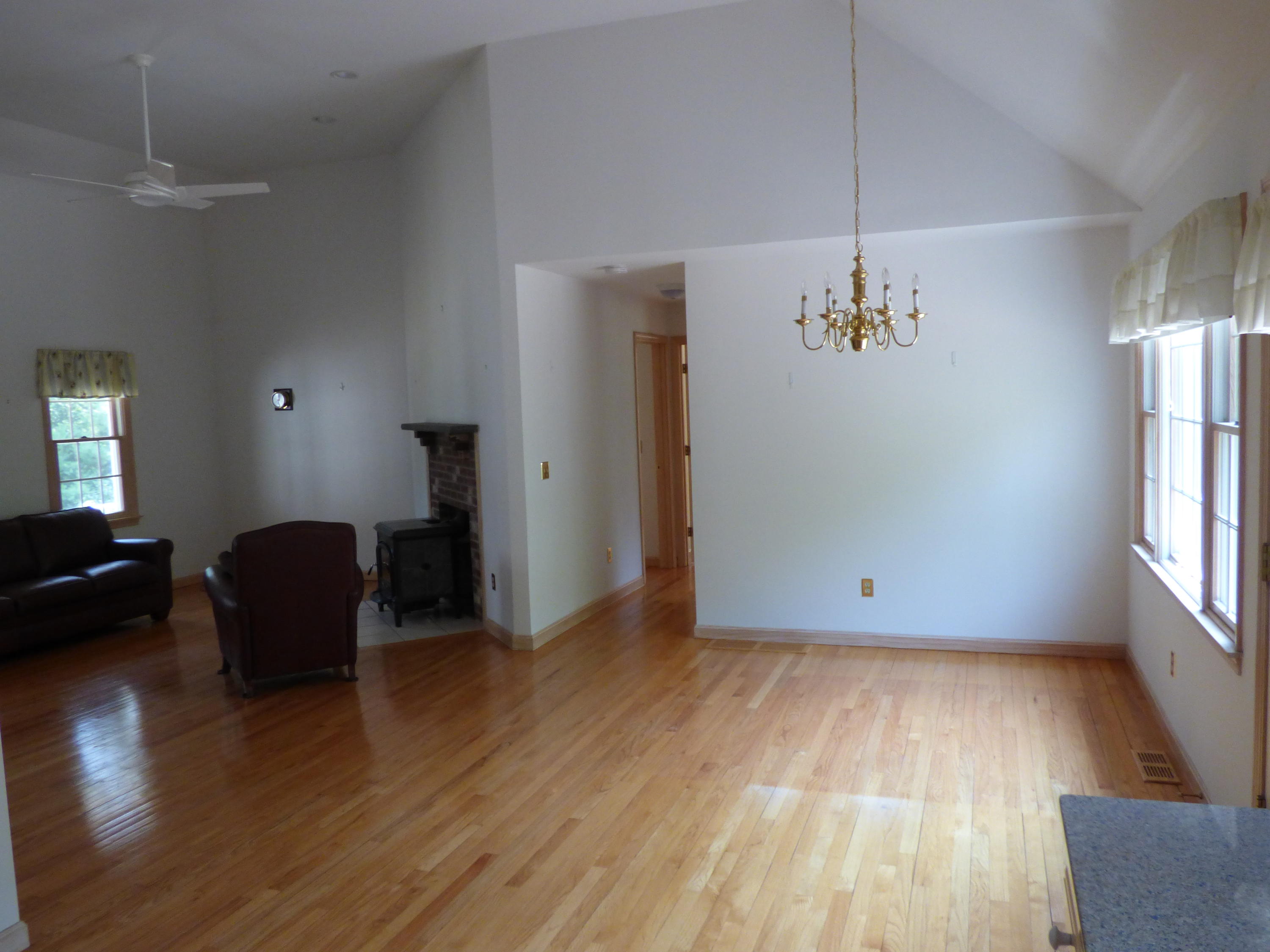 229 Woodside Road West Barnstable, MA 02668 - Photo 5 of 26 wooden floor in an empty room with a window
