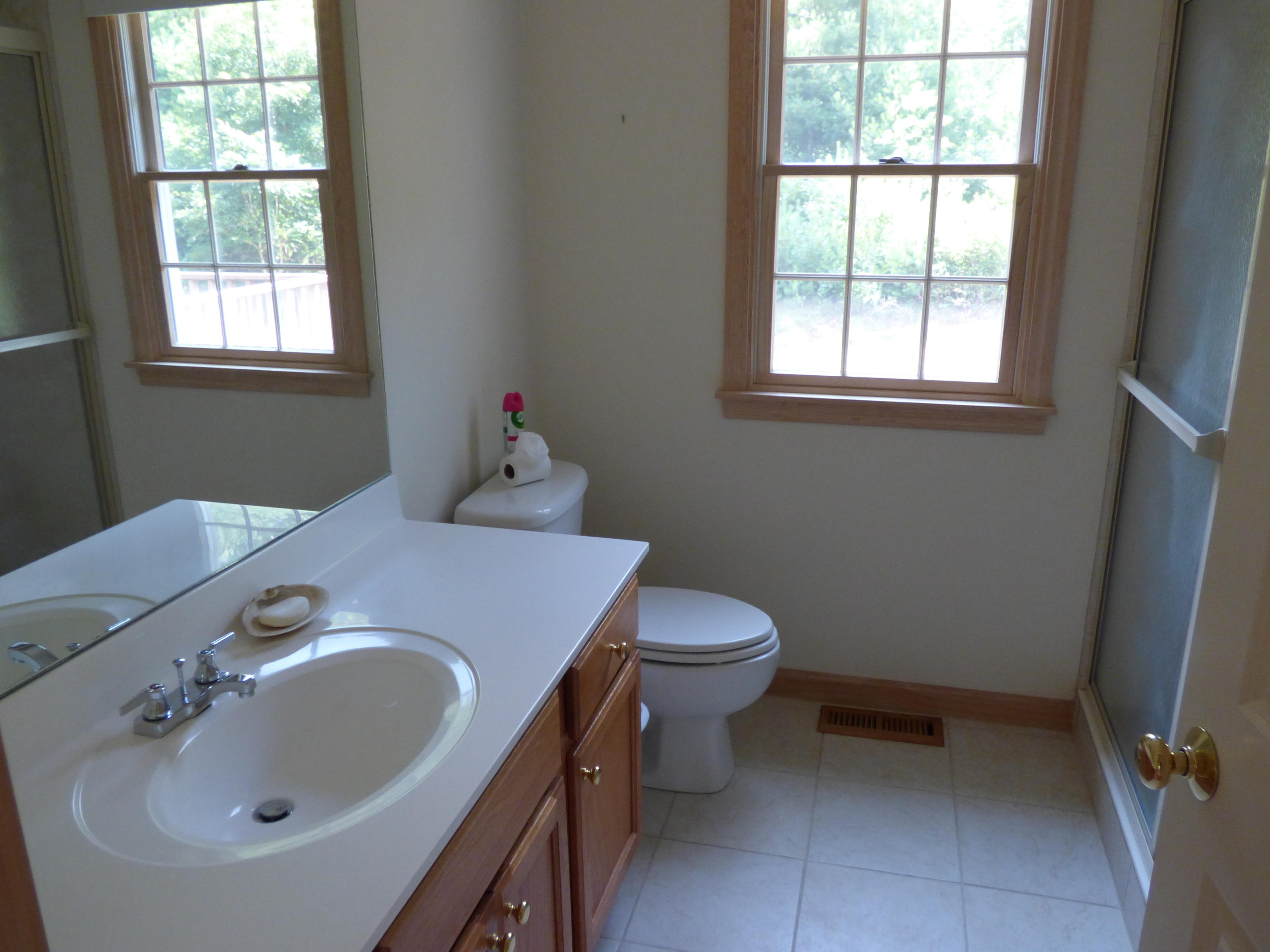 229 Woodside Road West Barnstable, MA 02668 - Photo 10 of 26 a bathroom with a sink and a toilet