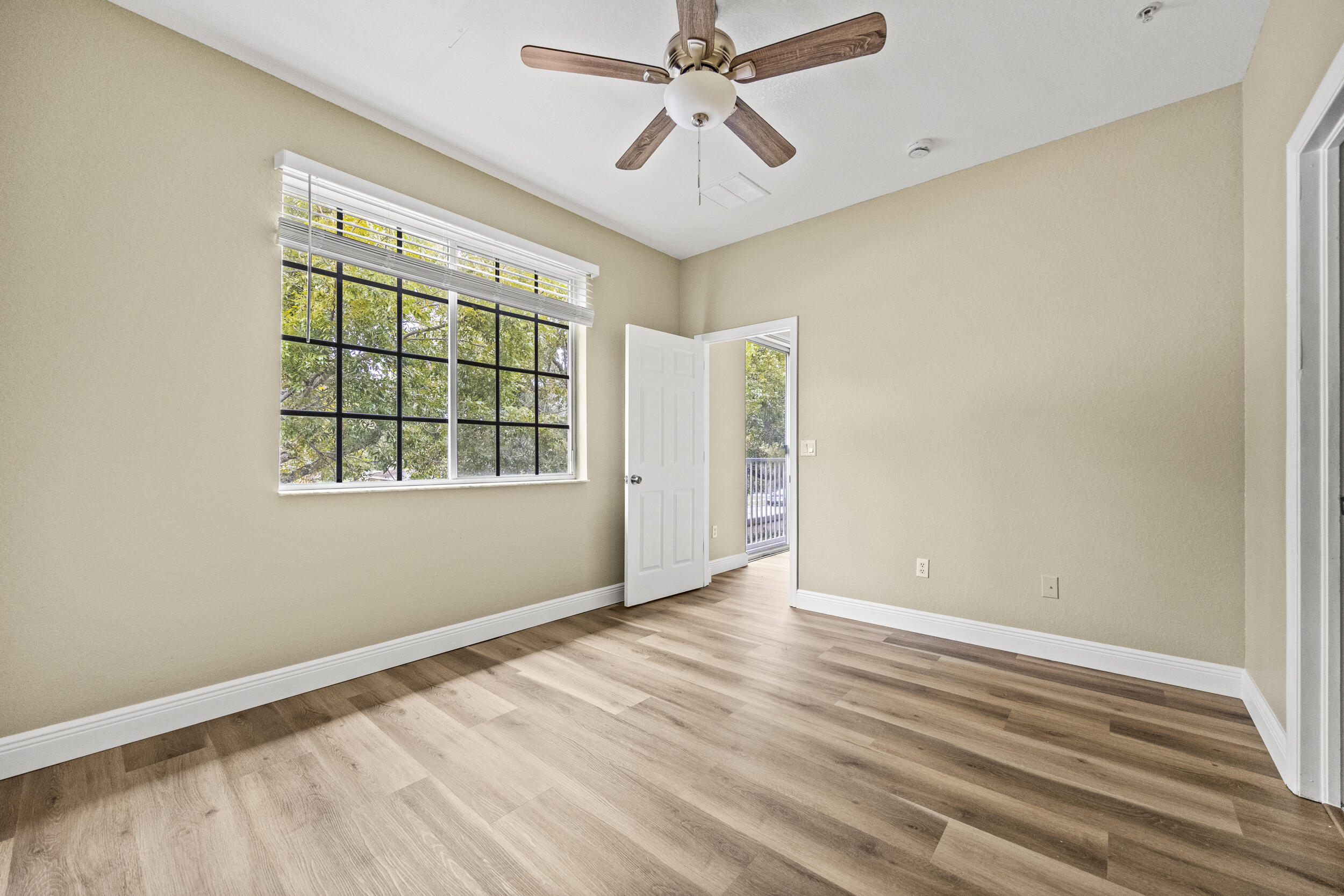 1982 Freeport Drive Riviera Beach, FL 33404 - Photo 13 of 31 an empty room with windows and fan