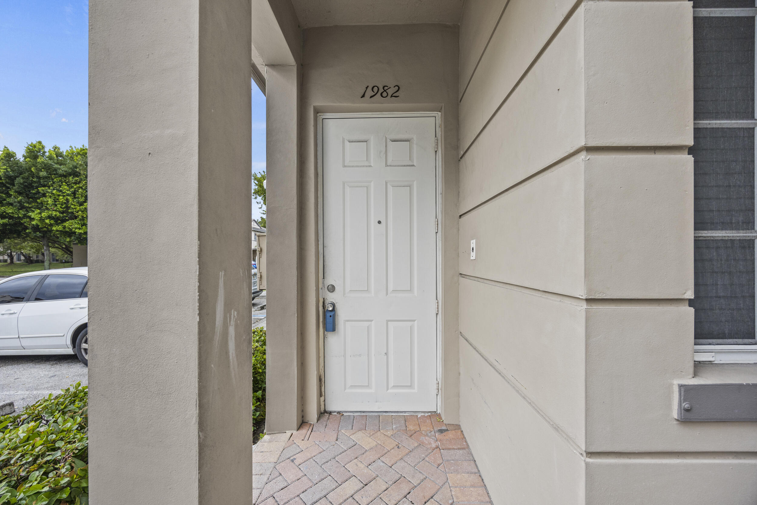 1982 Freeport Drive Riviera Beach, FL 33404 - Photo 28 of 31 a view of a hallway with a refrigerator and a couch