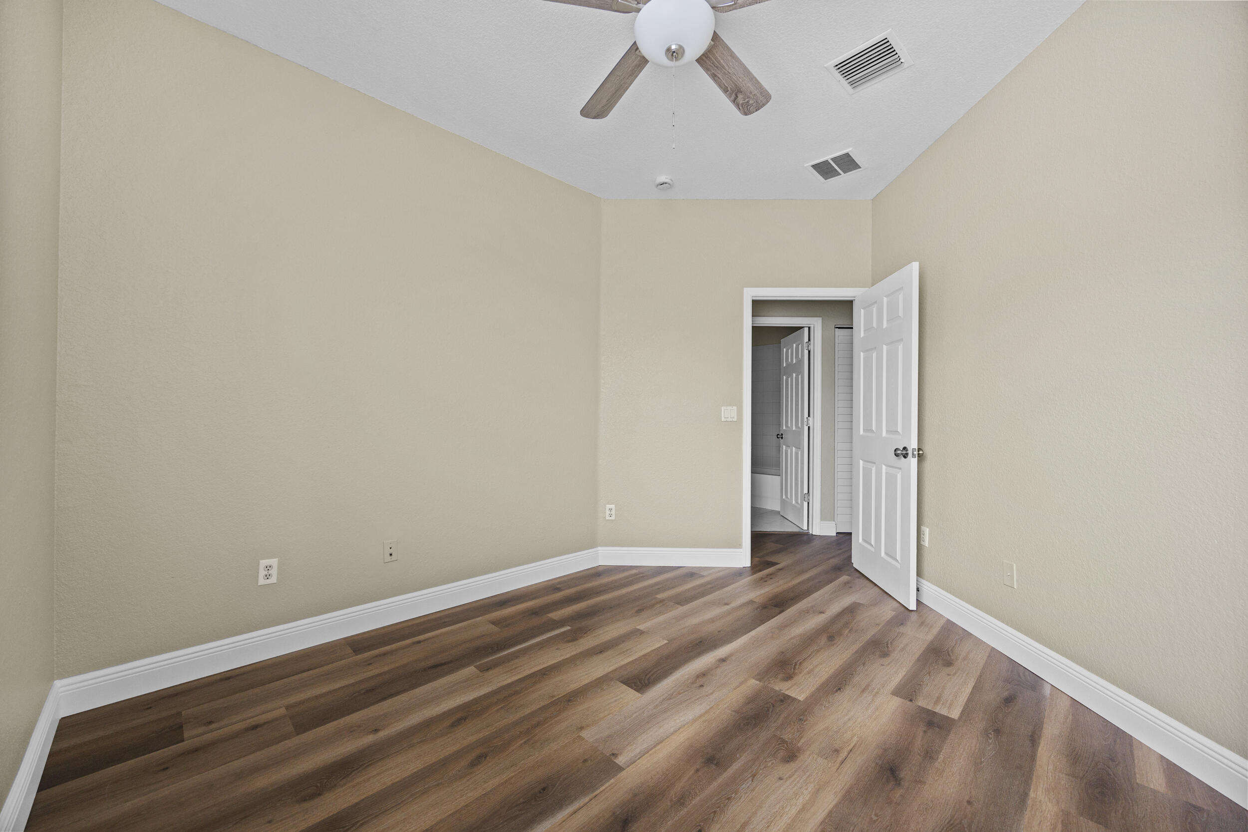 1982 Freeport Drive Riviera Beach, FL 33404 - Photo 3 of 31 a view of room with window and ceiling fan