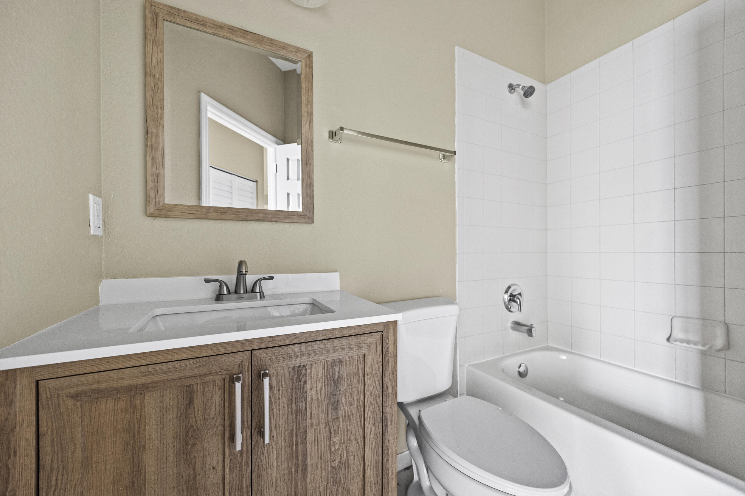1982 Freeport Drive Riviera Beach, FL 33404 - Photo 5 of 31 a bathroom with a sink a toilet and bathtub