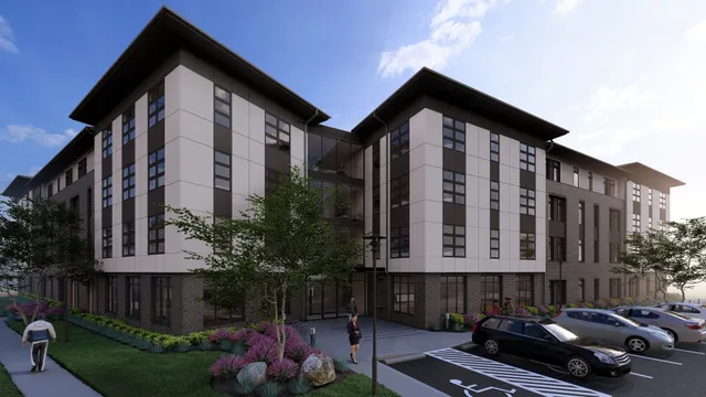 a front view of a building with garden