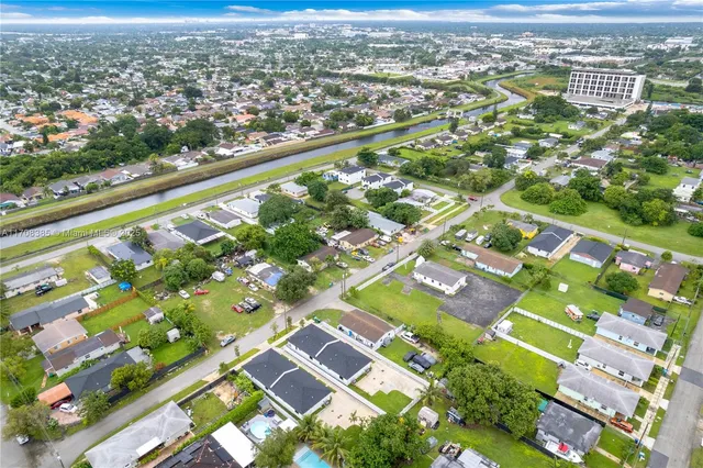 an aerial view of residential building with an outdoor space