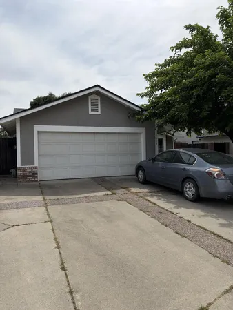 a car parked in front of a house