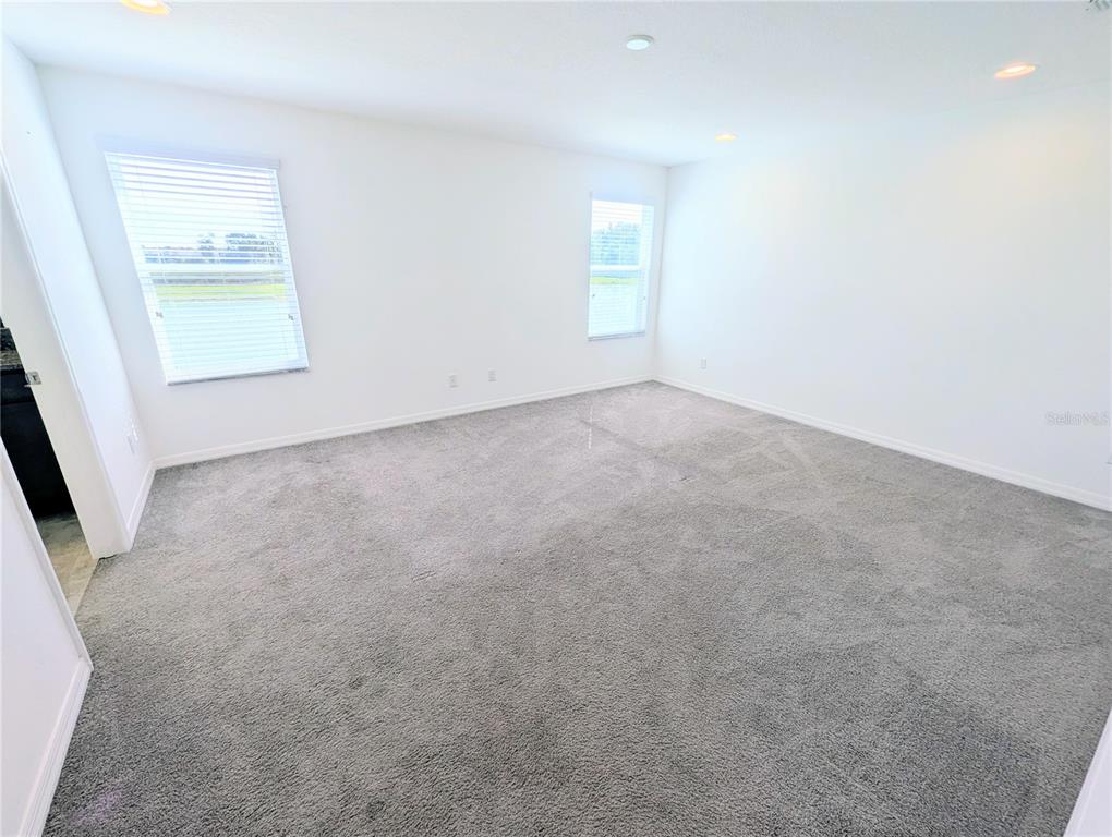 2944 Autumn Rock Drive Zephyrhills, FL 33540 - Photo 13 of 44 an empty room with windows