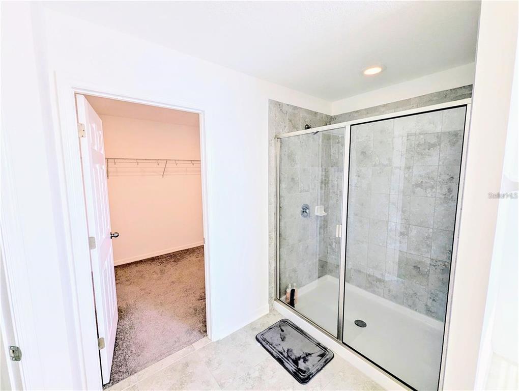 2944 Autumn Rock Drive Zephyrhills, FL 33540 - Photo 15 of 44 a bathroom with a shower and a sink