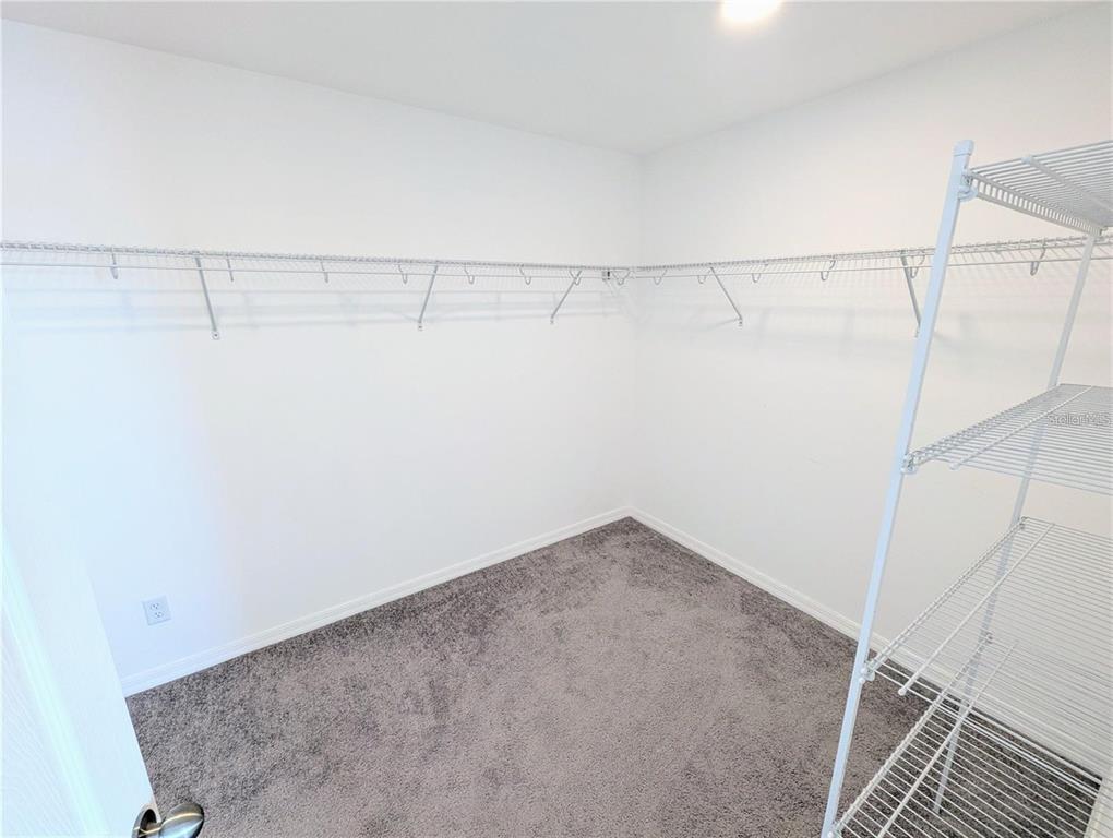 2944 Autumn Rock Drive Zephyrhills, FL 33540 - Photo 17 of 44 a view of a room with racks on the wall