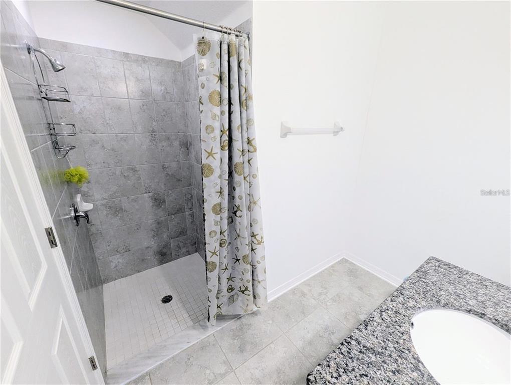 2944 Autumn Rock Drive Zephyrhills, FL 33540 - Photo 21 of 44 a bathroom with a shower and a sink