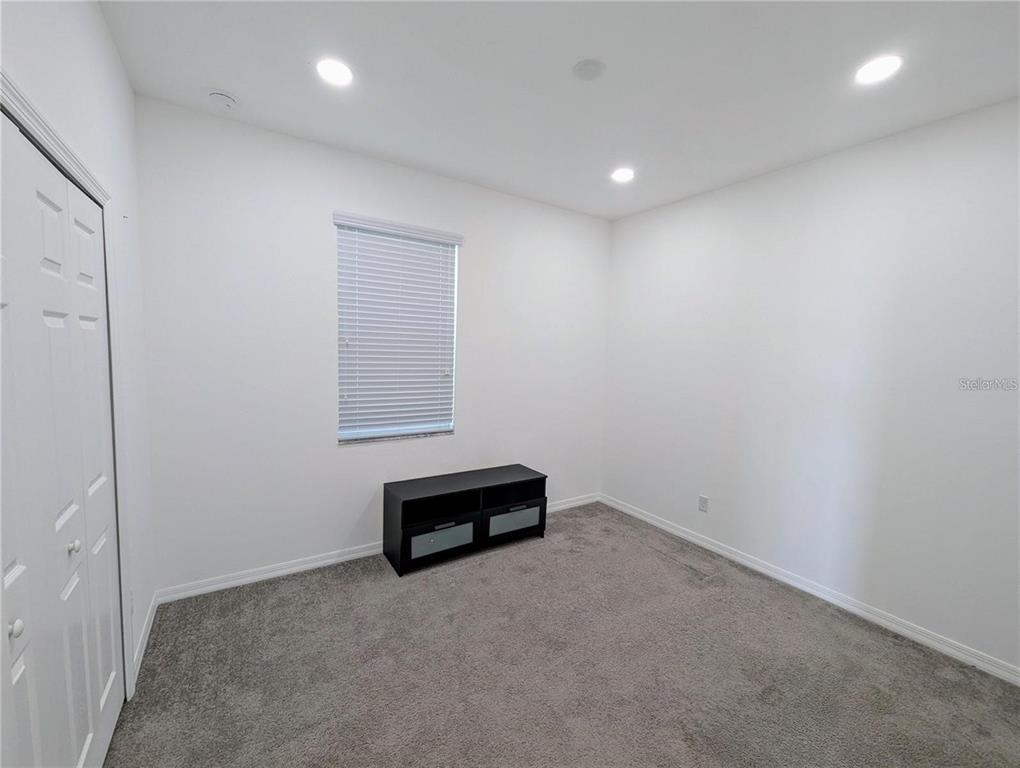 2944 Autumn Rock Drive Zephyrhills, FL 33540 - Photo 23 of 44 an empty room with cabinet