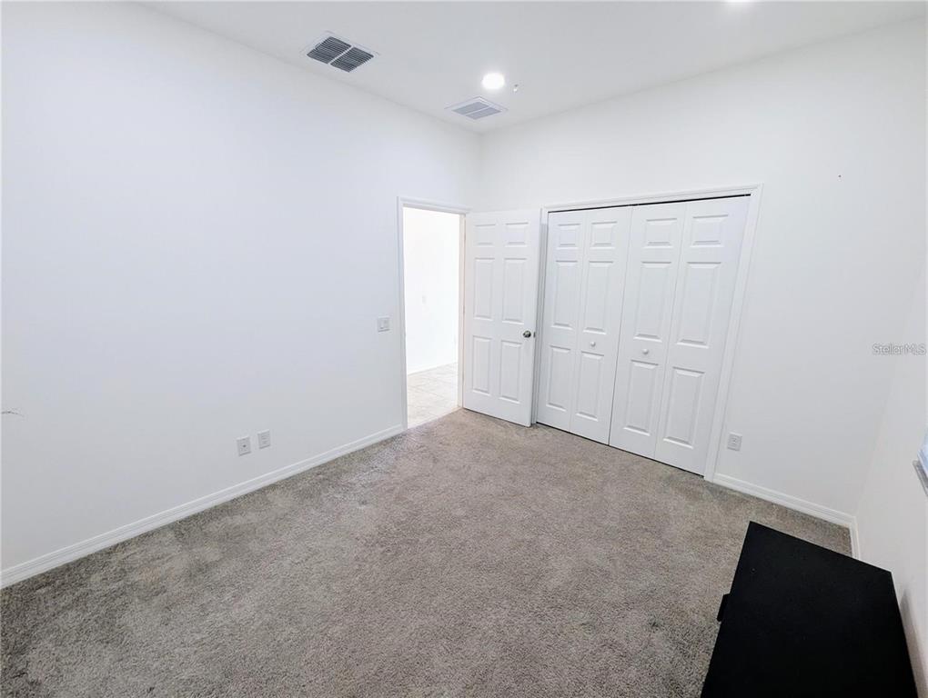 2944 Autumn Rock Drive Zephyrhills, FL 33540 - Photo 24 of 44 an empty room with closet area