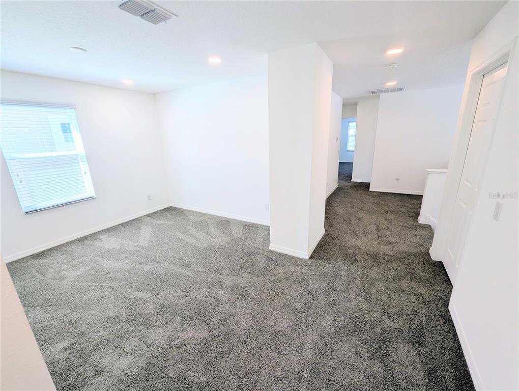 2944 Autumn Rock Drive Zephyrhills, FL 33540 - Photo 33 of 44 an empty room with windows