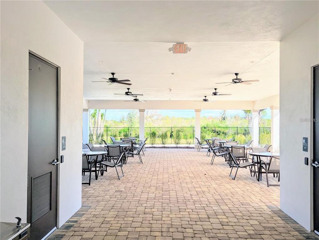 2944 Autumn Rock Drive Zephyrhills, FL 33540 - Photo 34 of 44 a view of a dining room with furniture window and outside view