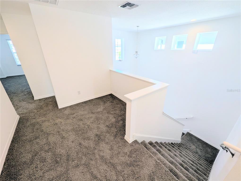 2944 Autumn Rock Drive Zephyrhills, FL 33540 - Photo 35 of 44 an empty room with windows