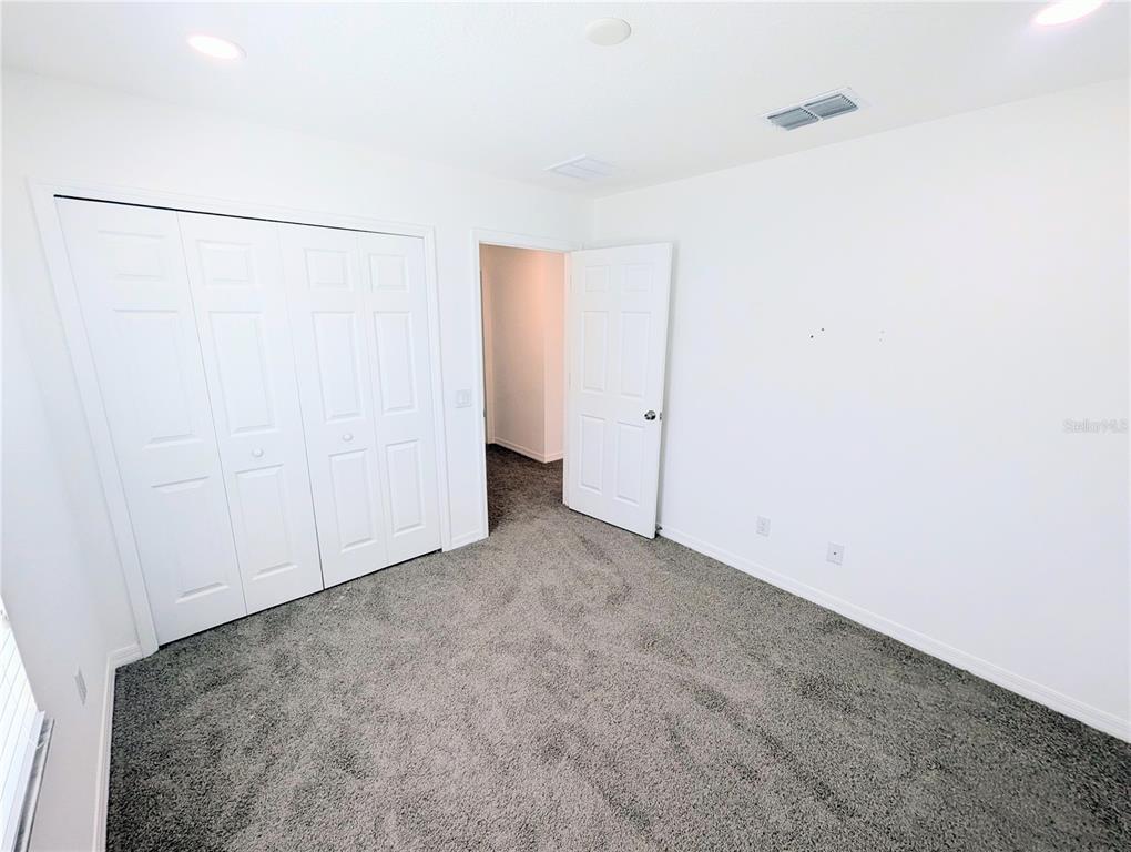 2944 Autumn Rock Drive Zephyrhills, FL 33540 - Photo 38 of 44 a view of an empty room