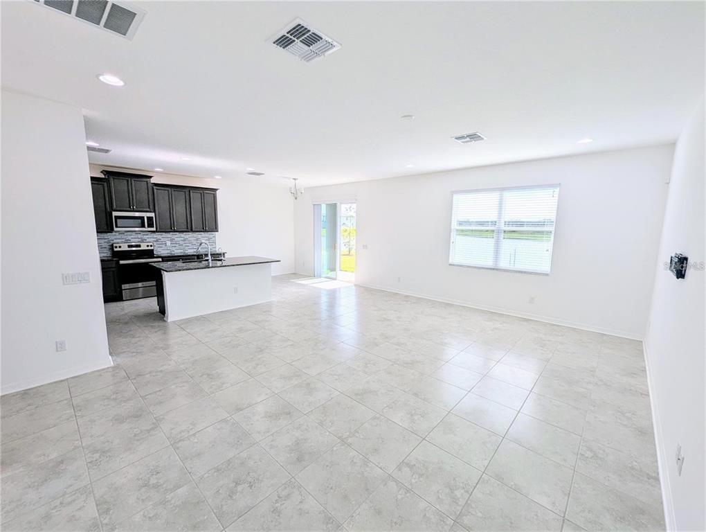 2944 Autumn Rock Drive Zephyrhills, FL 33540 - Photo 9 of 44 a view of kitchen and microwave