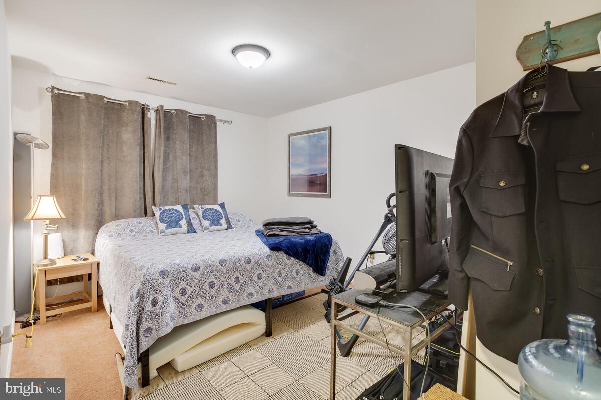 2546 Aster Road Port Republic, MD 20676 - Photo 51 of 54 a bedroom with a bed and wooden floor