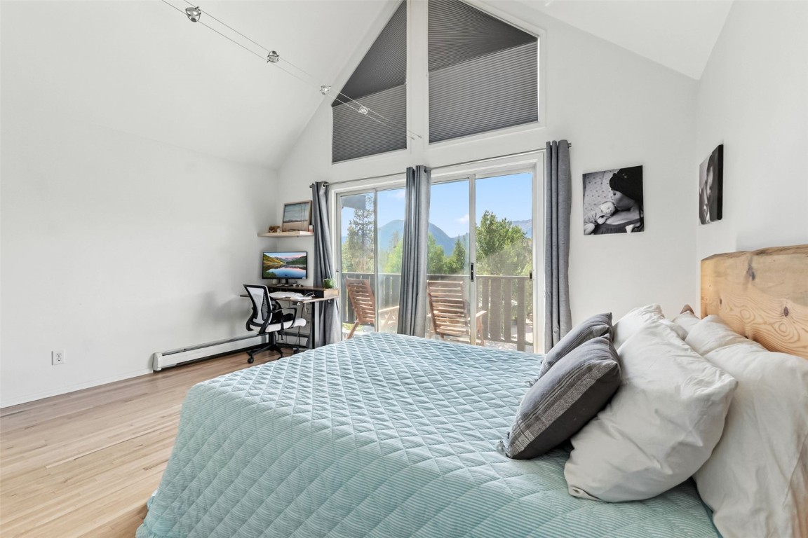 218 Deer Path Road Dillon, CO 80435 - Photo 19 of 49 a bedroom with a bed and a large window