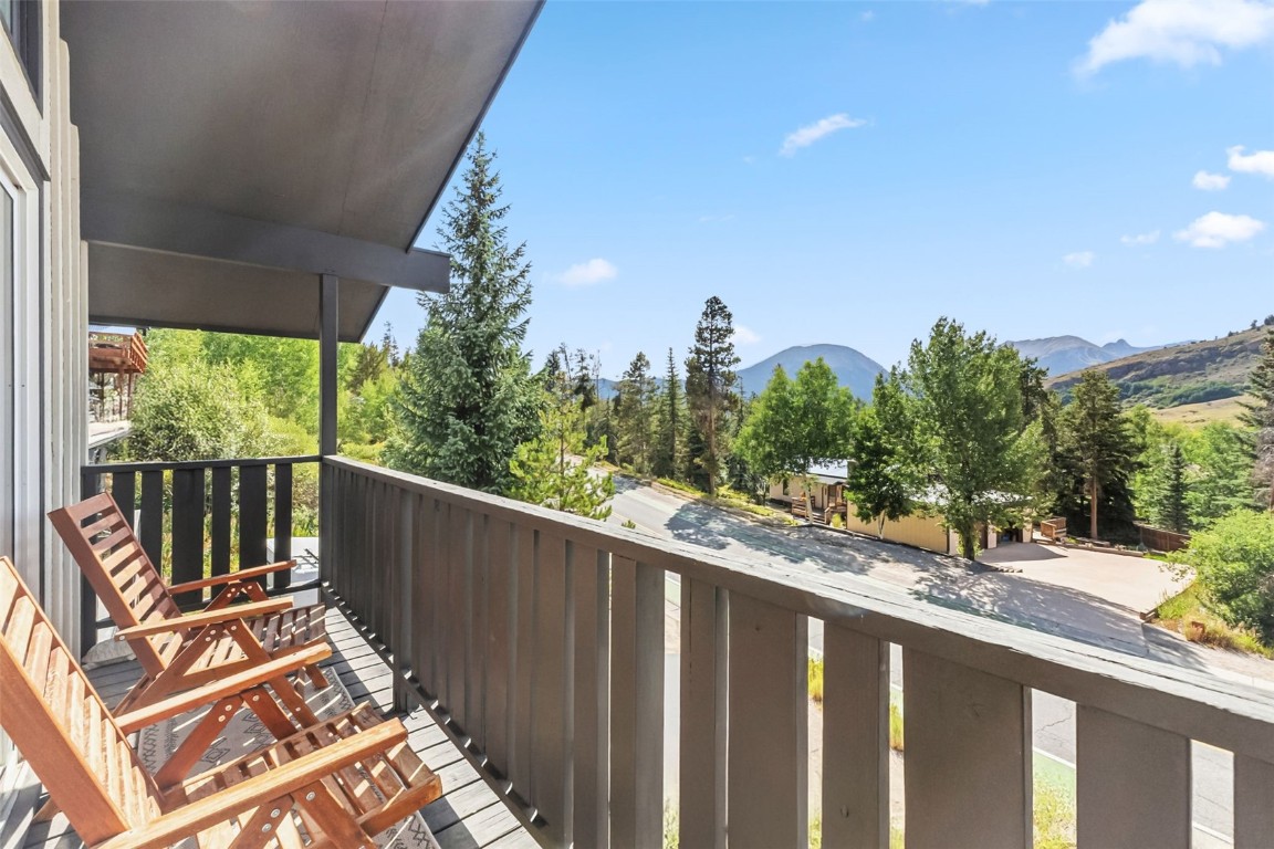 218 Deer Path Road Dillon, CO 80435 - Photo 20 of 49 a view of a balcony with wooden floor and fence